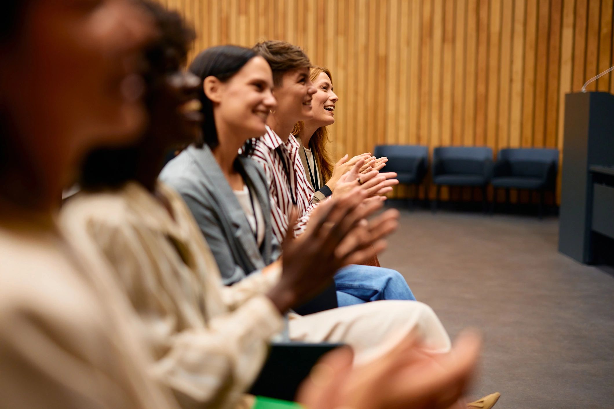 Audience applauding during a formal public program