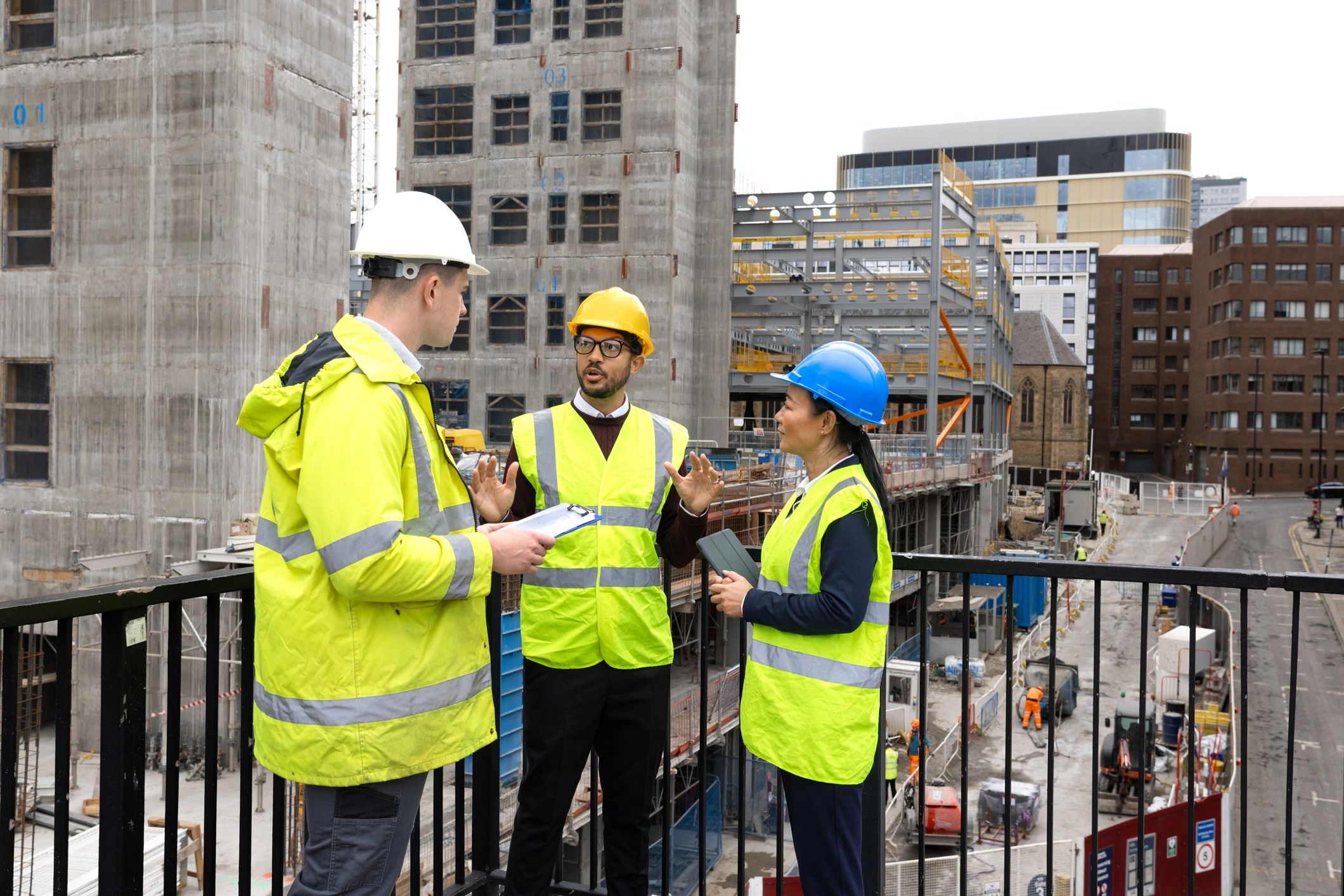 Development project team reviewing plans on site